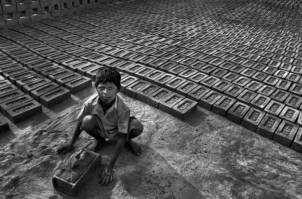 Child Brick Worker by Avishek Das — canvas wall art