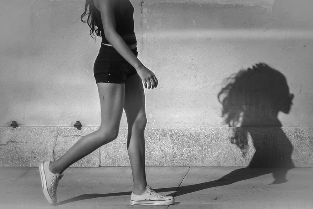 Woman Walking Shadow by Andy Bauer — canvas wall art