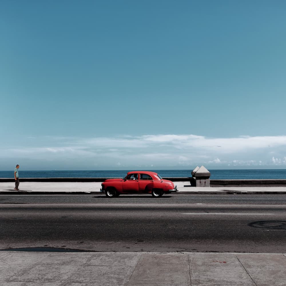 Classic Red Car Coast by Jorge Pimenta — canvas wall art