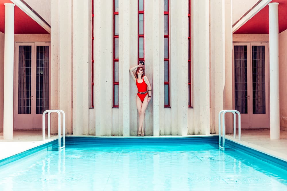 Red Swimsuit Poolside by Ruslan Bolgov — canvas wall art