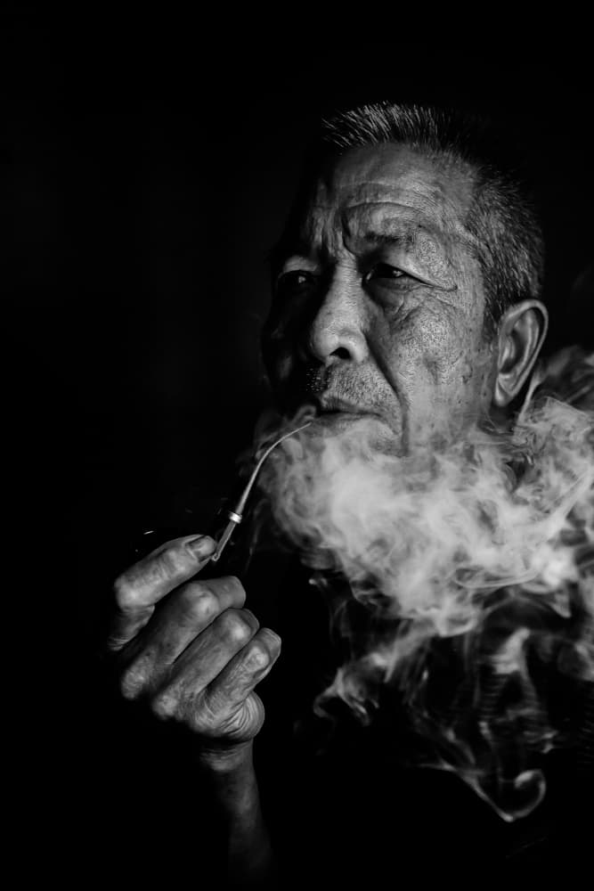 Pensive Pipe Smoker by Amnon Eichelberg — canvas wall art