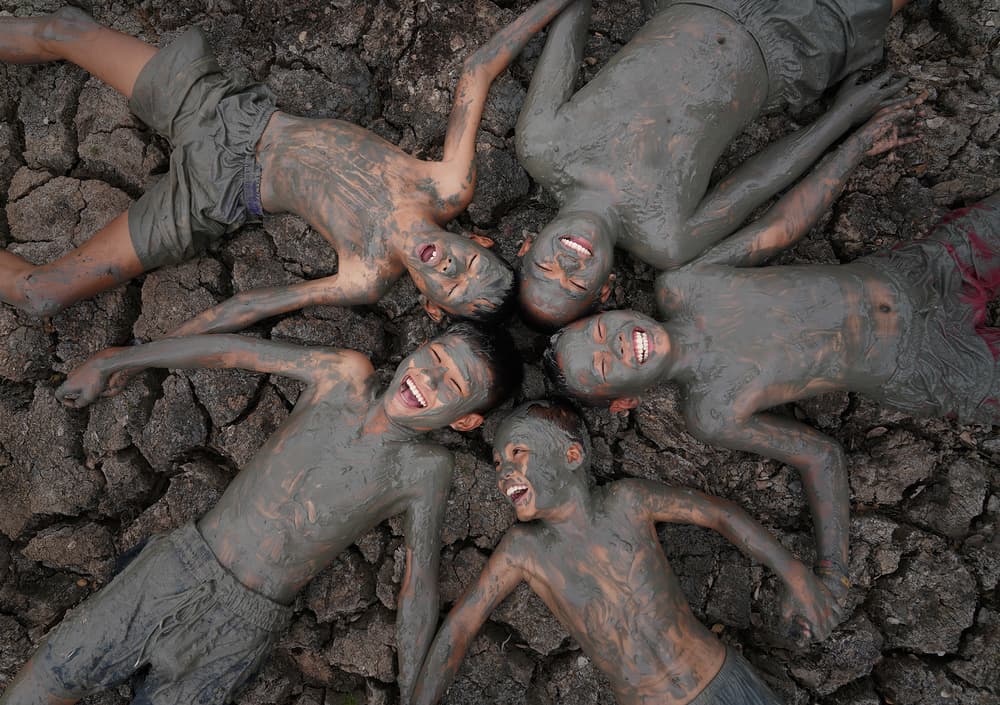 Joyful Mud Play by Sarawut Intarob — canvas wall art