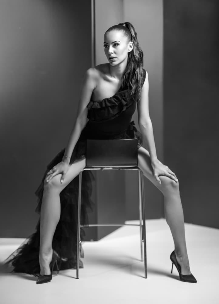 Elegant Black Dress Pose by Vasil Nanev — canvas wall art