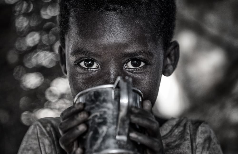 Young Boy Drinking by Joxe Inazio Kuesta Garmendia — canvas wall art