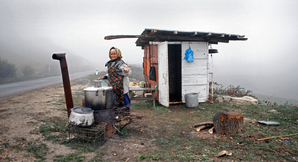 Smiling Woman Cooking Outdoors by Garik — canvas wall art