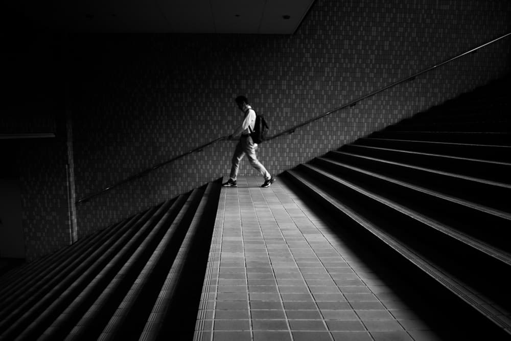 Man on Geometric Stairs by Satoshi Hata — canvas wall art