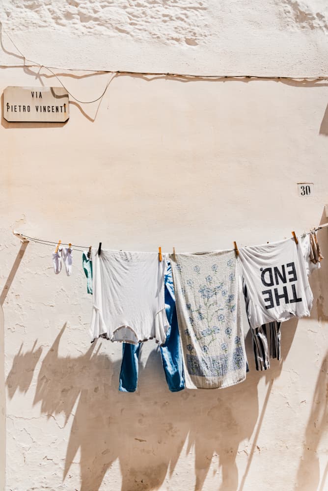 Sunlit Street Laundry by Photolovers — canvas wall art