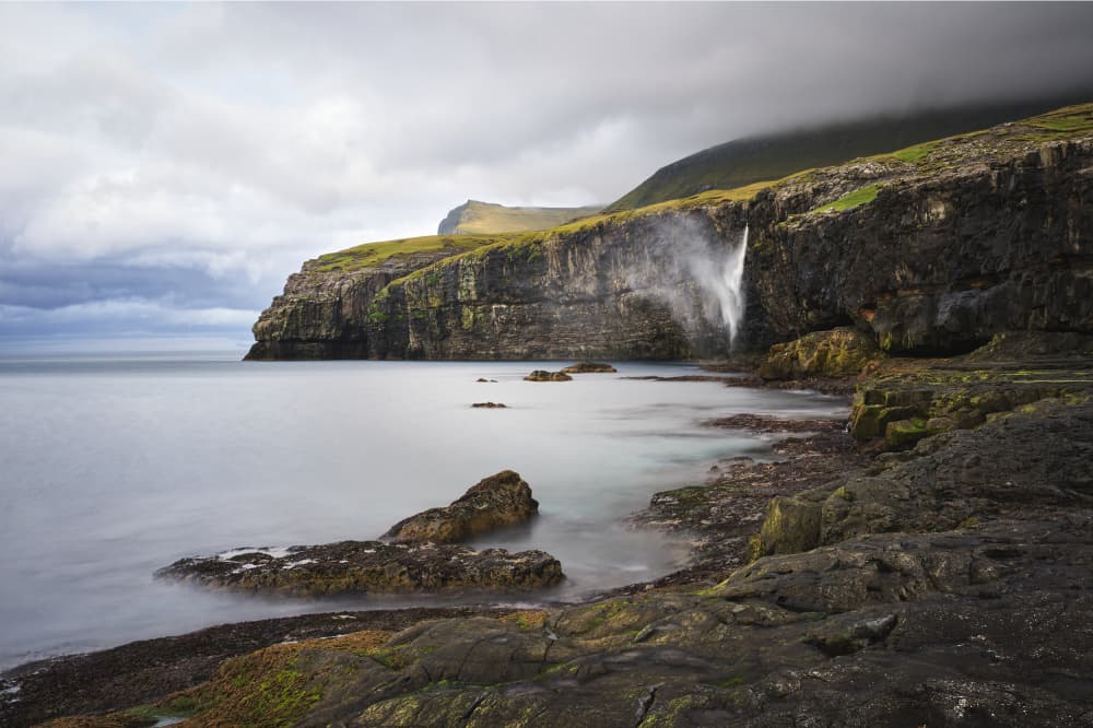 Rugged Coastal Waterfall by Hamed Bank — canvas wall art