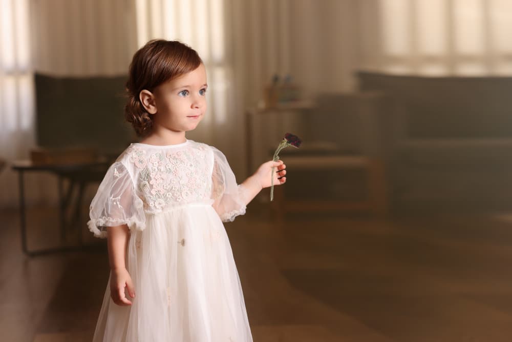 Gentle Girl Holding Flower by AYMAN KHRBAWE — canvas wall art