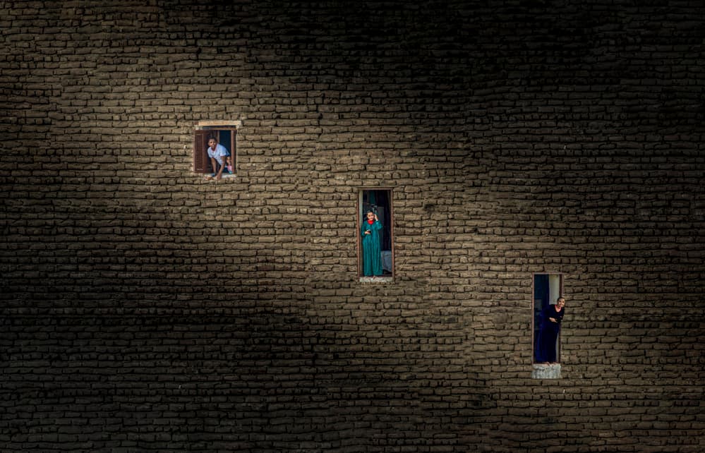 People In Brick Windows by John-Mei Zhong — canvas wall art