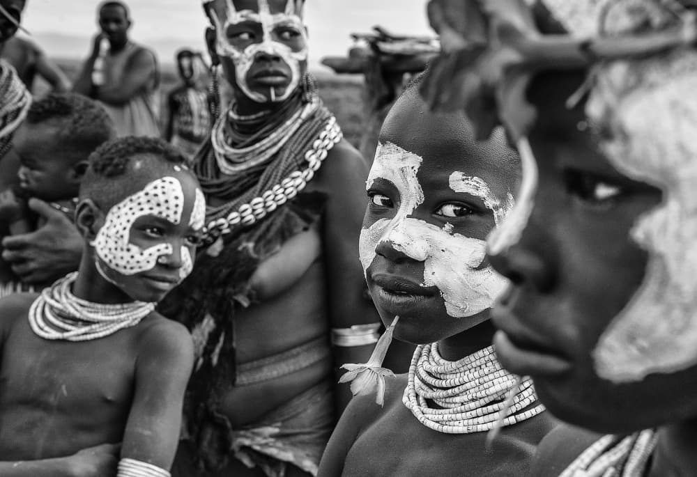 African Painted Faces by Joxe Inazio Kuesta Garmendia — canvas wall art