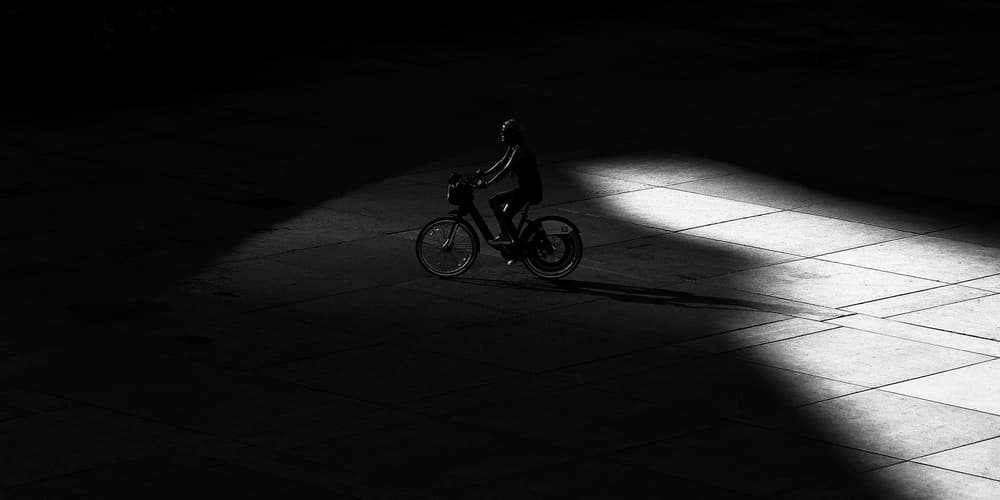 Cyclist In Spotlight by Jian Wang — canvas wall art