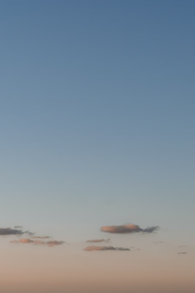 Soft Dusk Sky with Blush Clouds at Sunset in Pastel Blue & Peach by Aimee Giles — canvas wall art