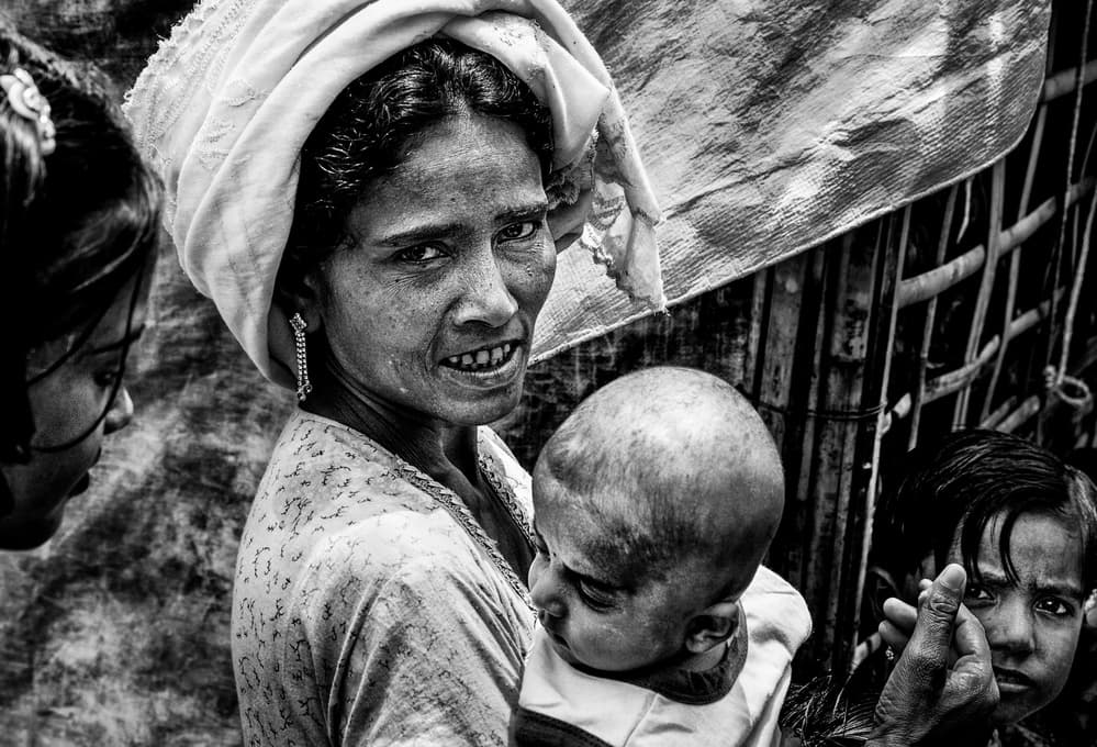 Mother Child Soulful Gaze by Joxe Inazio Kuesta Garmendia — canvas wall art