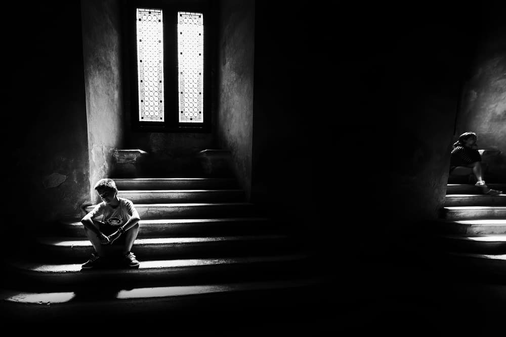 Pensive Boy on Stairs by Marius Cinteza — canvas wall art