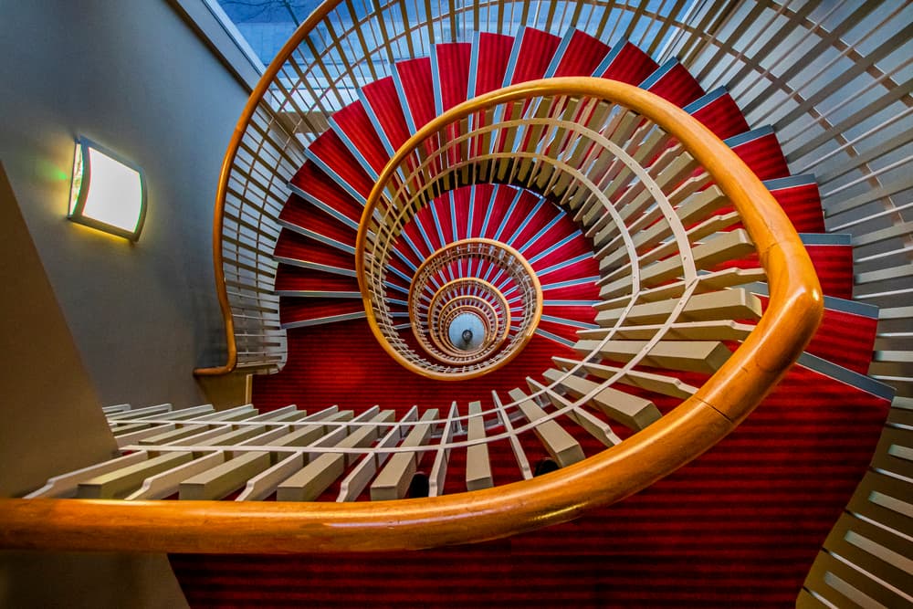 Red Spiral Staircase by Hardik Pandya — canvas wall art