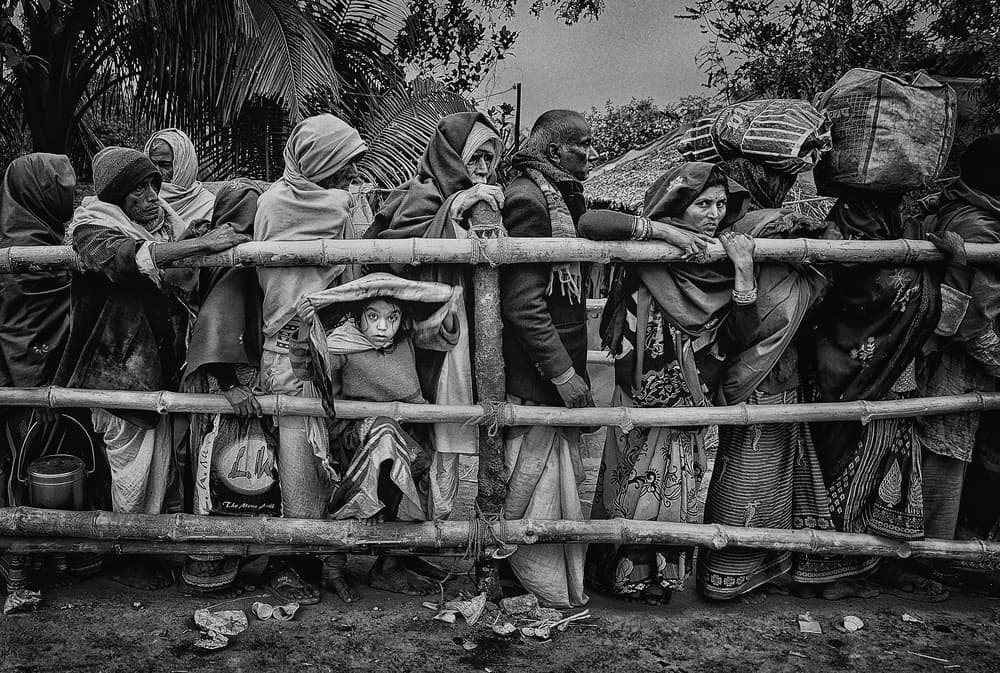 Curious Child Behind Fence by Avishek Das — canvas wall art