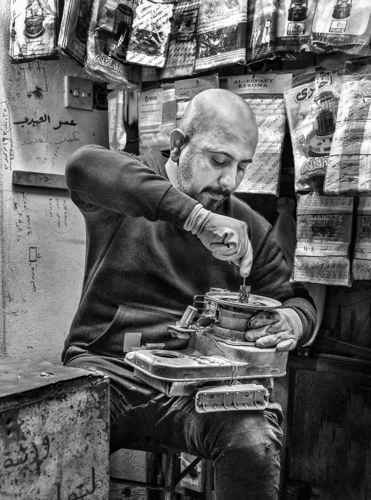 Workshop Repairman At Work by Bashar Alsofey — canvas wall art