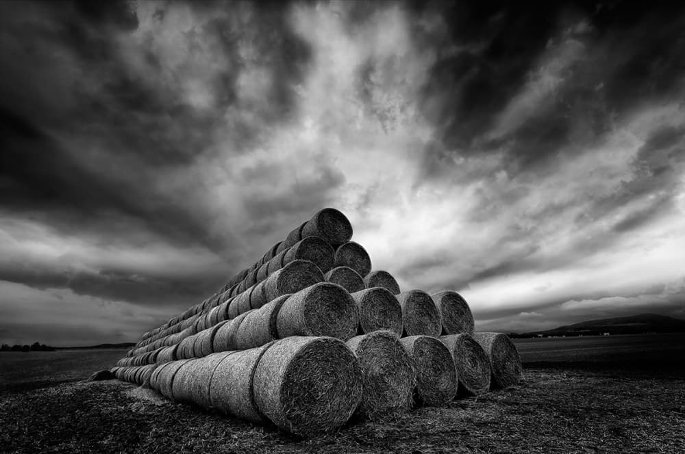 Dramatic Hay Bales Field by Piotr Krol (Bax) — canvas wall art