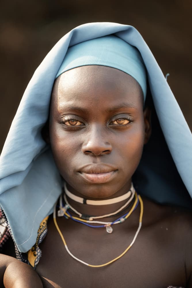 African Woman's Serene Gaze by Trevor Cole — canvas wall art
