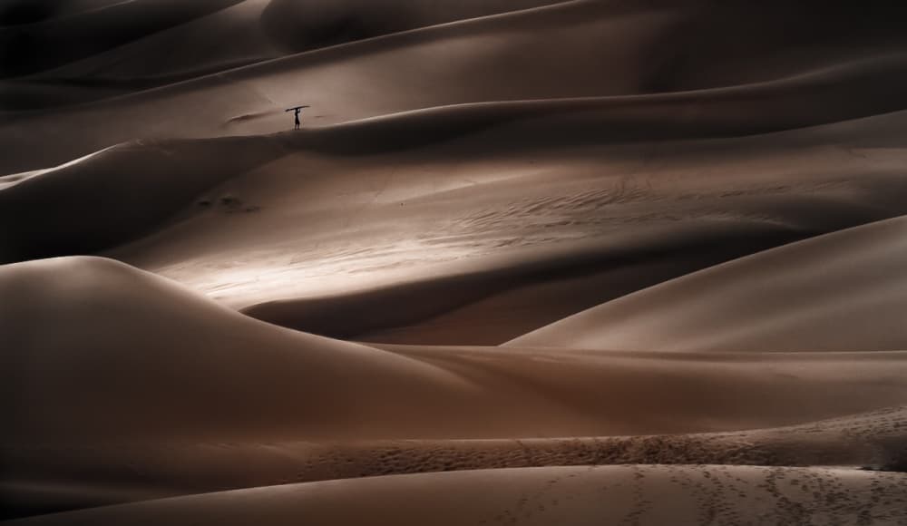 Lone Figure Dunes by Lior Yaakobi — canvas wall art