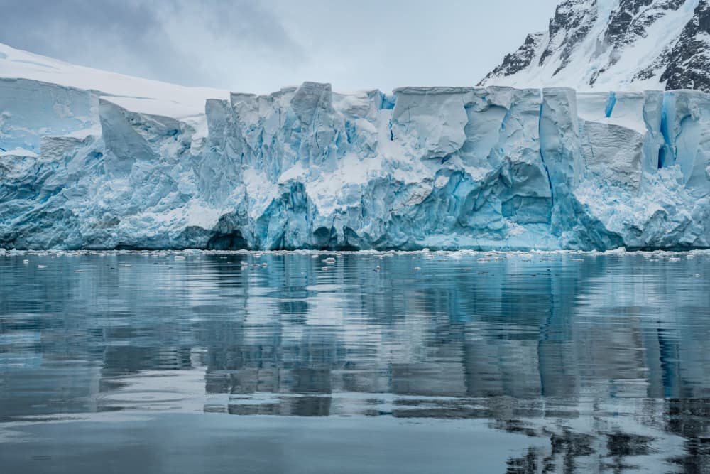 Blue Ice Glacier Reflection by Nanda Bussers — canvas wall art