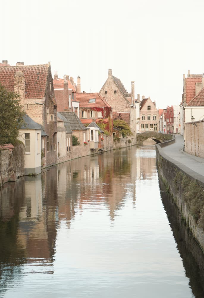 Serene City Canal Reflections by Courtney Crane — canvas wall art