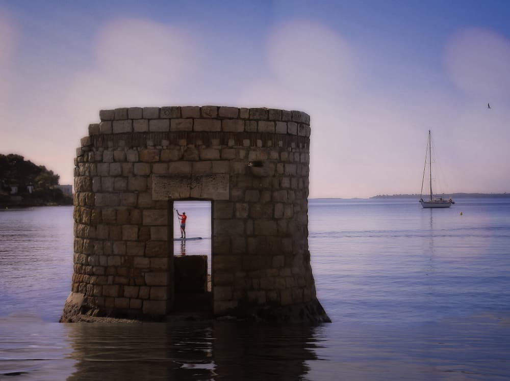Paddleboarder in Stone Tower by Anna Cseresnjes — canvas wall art