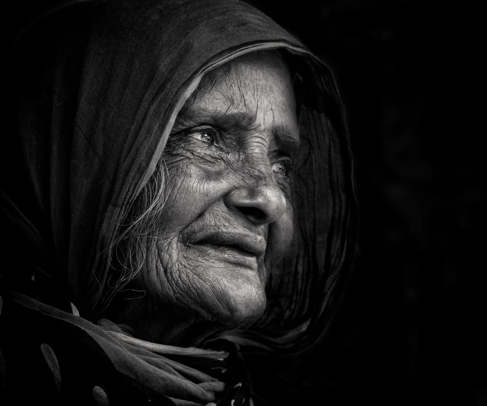 Pensive Elderly Woman by Elena Molina — canvas wall art