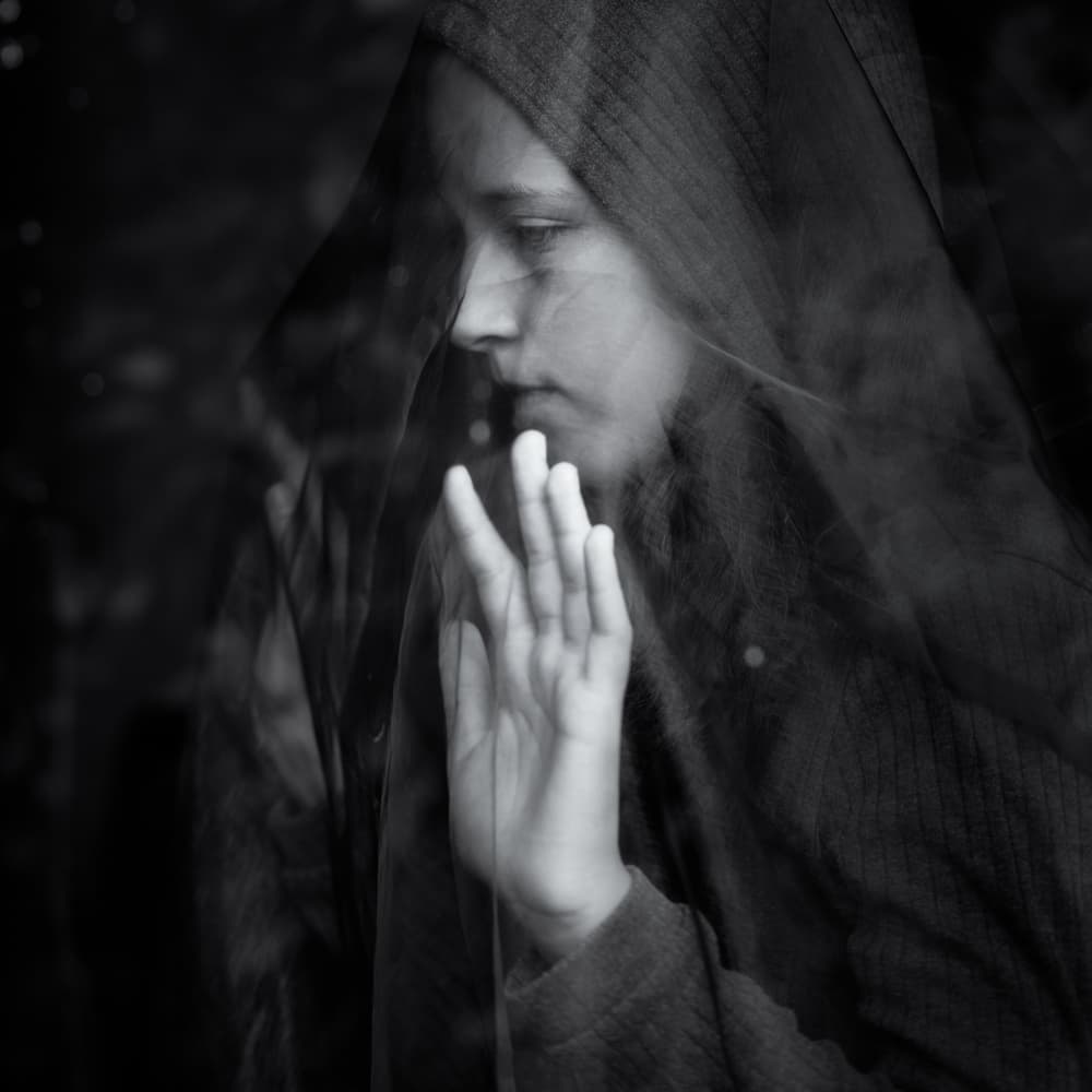 Pensive Hooded Woman by Mirjam Delrue — canvas wall art