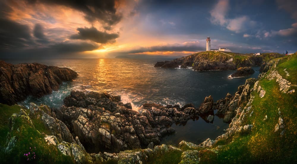 Golden Coastal Lighthouse Sunset by Krzysztof Browko — canvas wall art