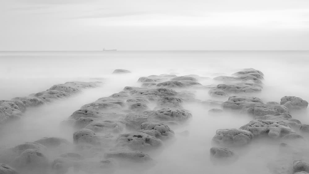 Smooth Water Rocks by Paulo Abrantes — canvas wall art