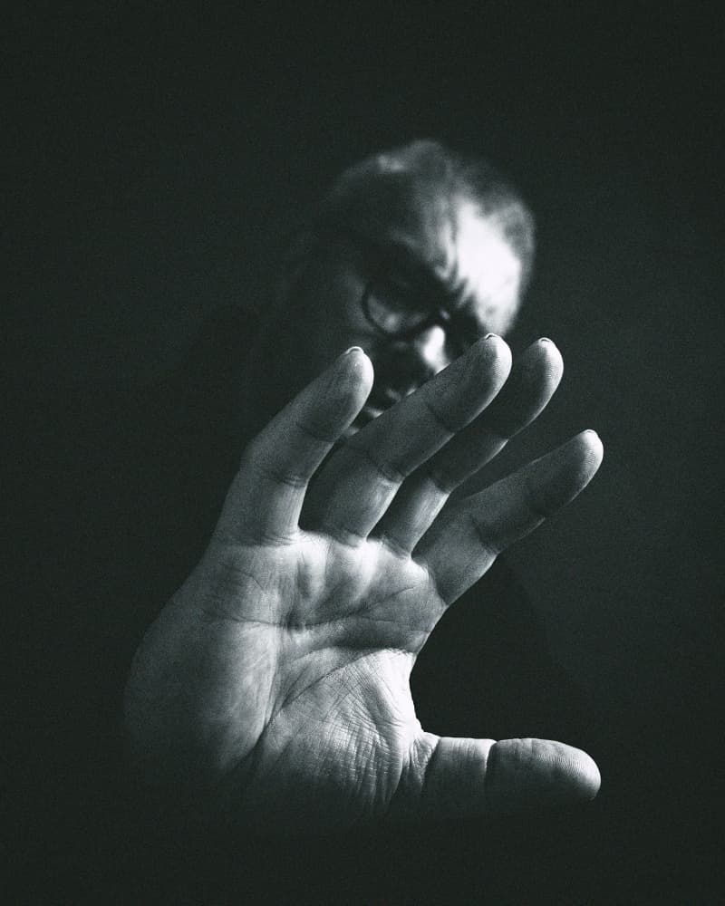 Man Behind Outstretched Hand by Stefan Eisele — canvas wall art