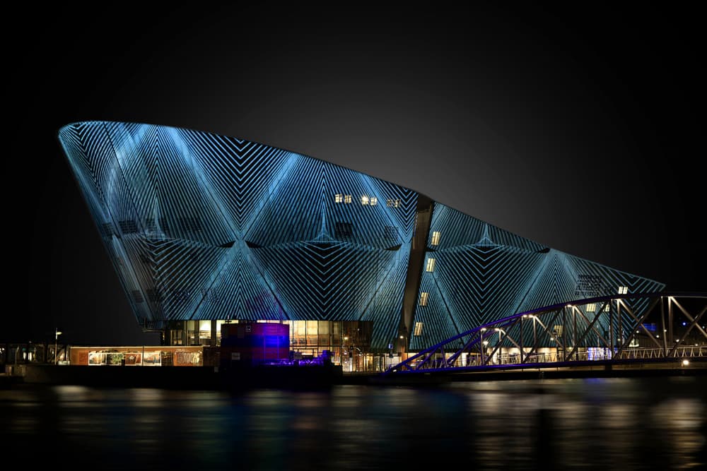 Blue Lighted Modern Building by Wilma Wijers Smeets — canvas wall art