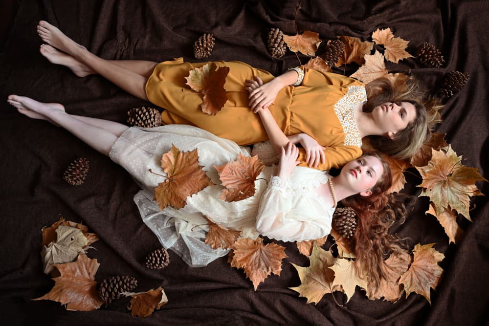 Women Among Autumn Leaves by Iris Resch — canvas wall art