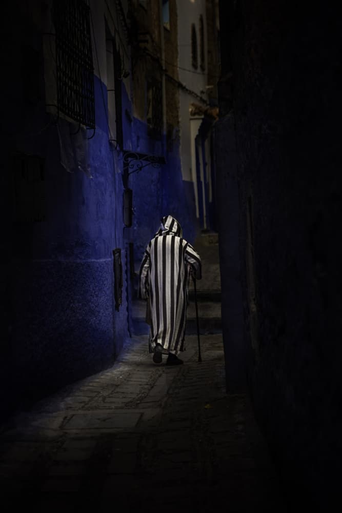 Hooded Figure Blue Alley by Moris Raskin — canvas wall art