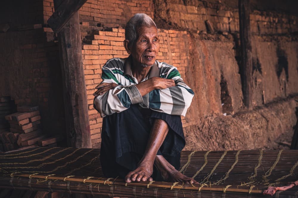 Thoughtful Elder Sitting by Marco Tagliarino — canvas wall art