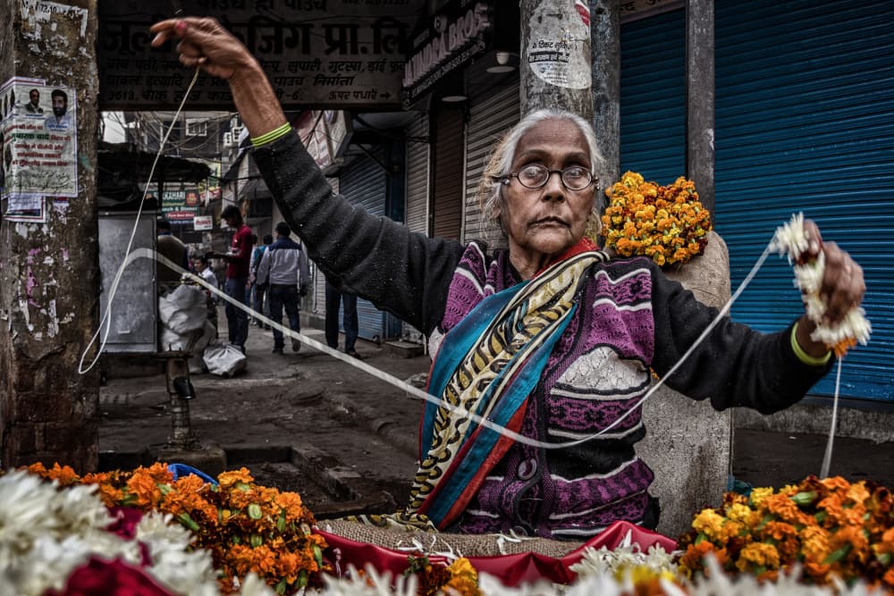 Indian Flower Vendor by Pavol Stranak — canvas wall art