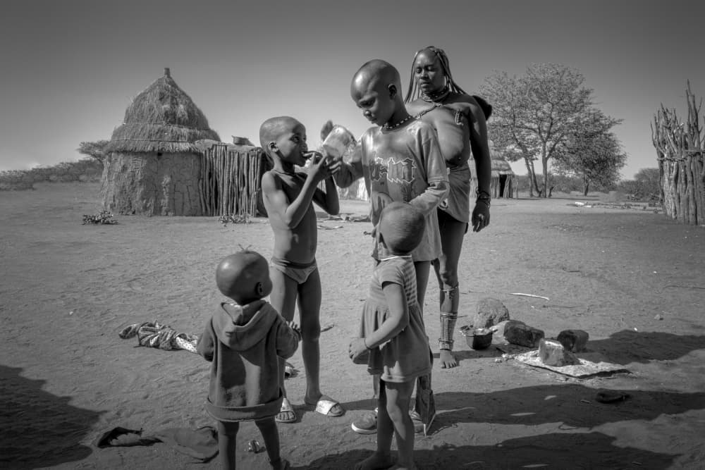 African Children Sharing Water by Dennis Zhang — canvas wall art