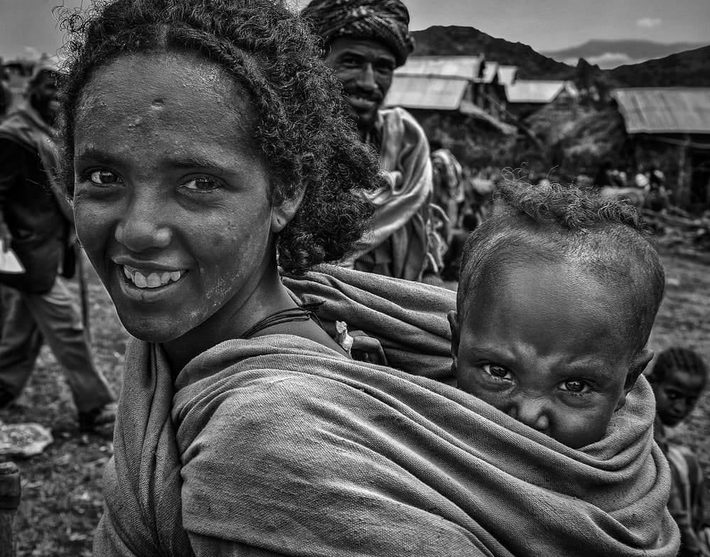 African Mother Baby Smile by Joxe Inazio Kuesta Garmendia — canvas wall art