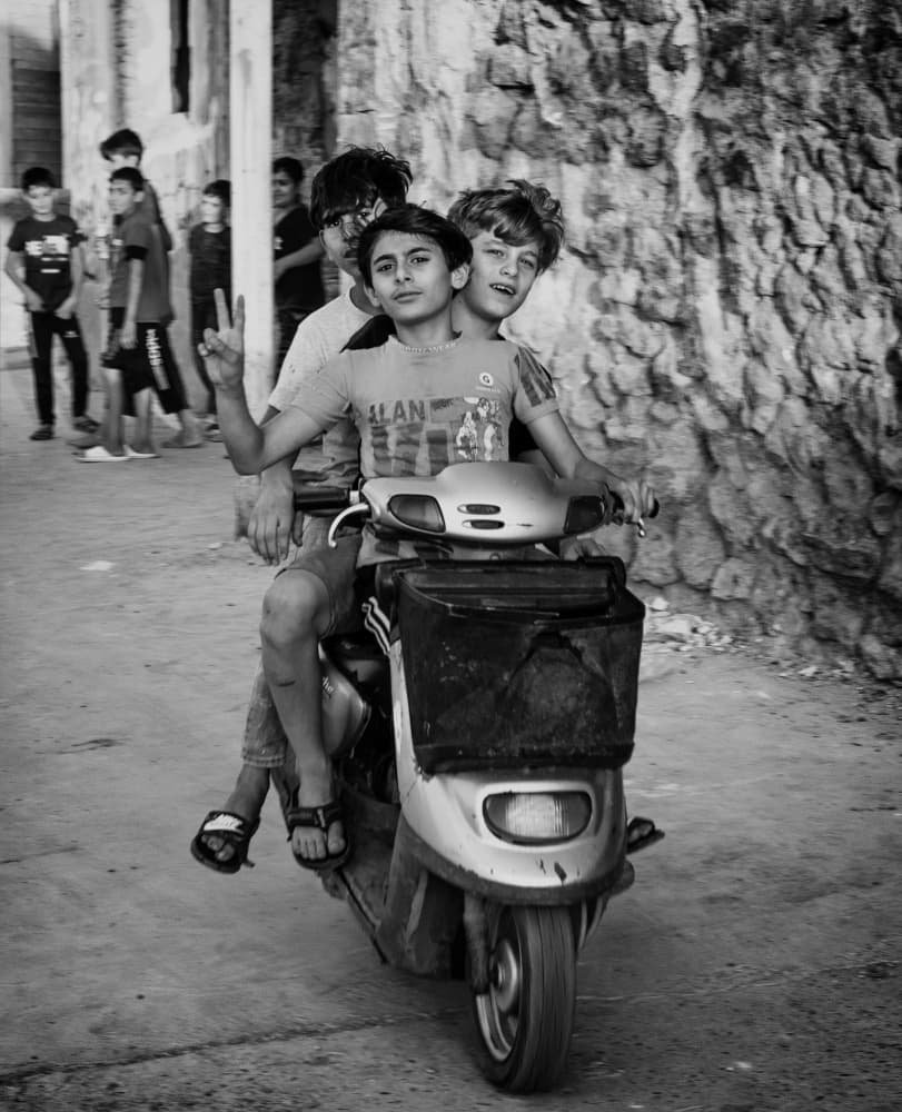 Street Kids Scooter Ride by Jalili — canvas wall art