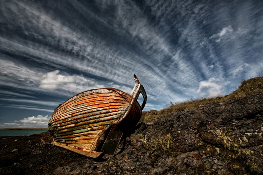 Weathered Boat Dramatic Sky by Þorsteinn H. Ingibergsson — canvas wall art