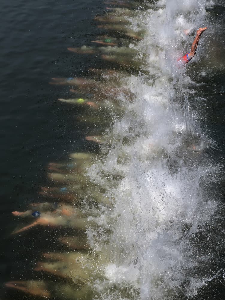 Swimmers Powering Through by Klaus Lenzen — canvas wall art