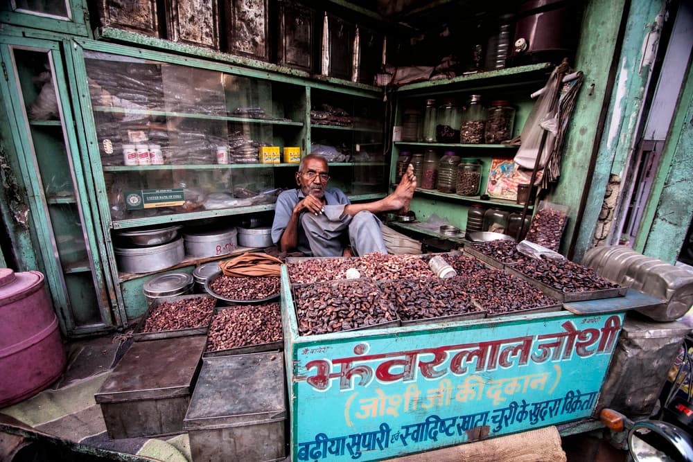 Indian Market Shopkeeper by Svetlin Yosifov — canvas wall art