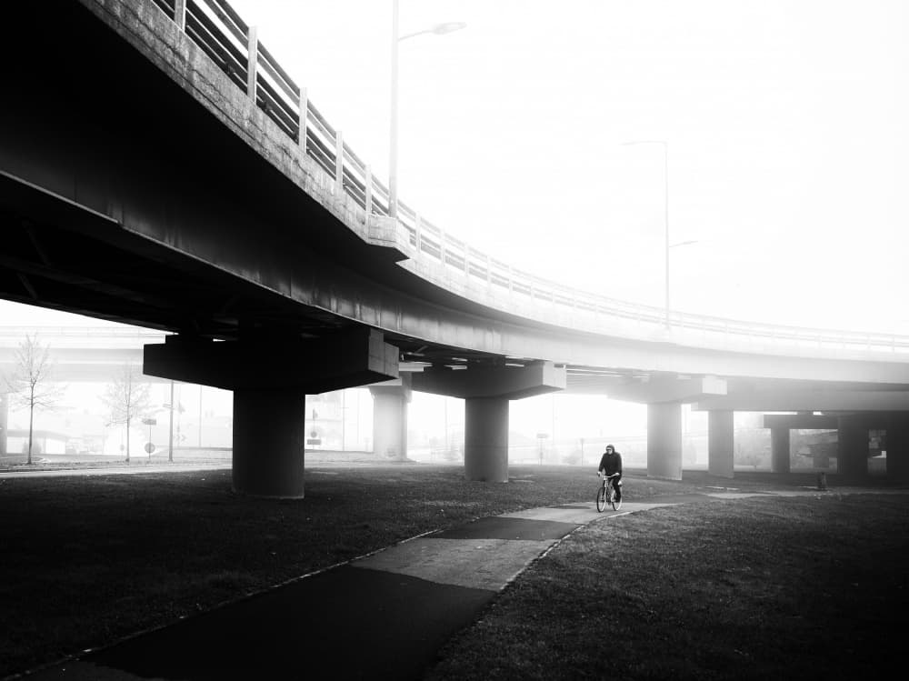 Foggy Underpass Cyclist by Julien Oncete — canvas wall art