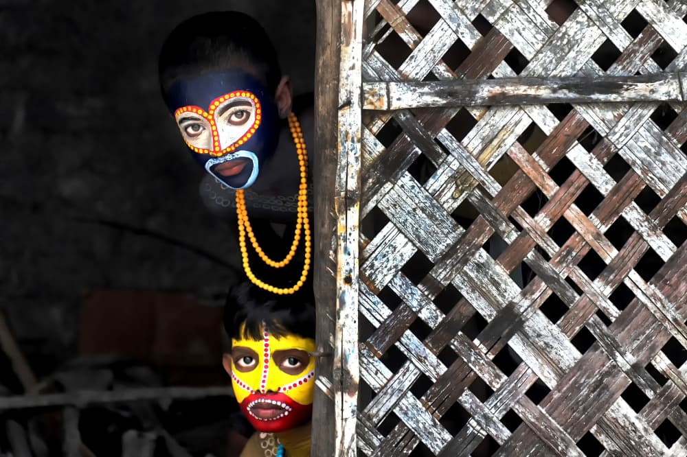 Painted Faces Peeking by Avishek Das — canvas wall art