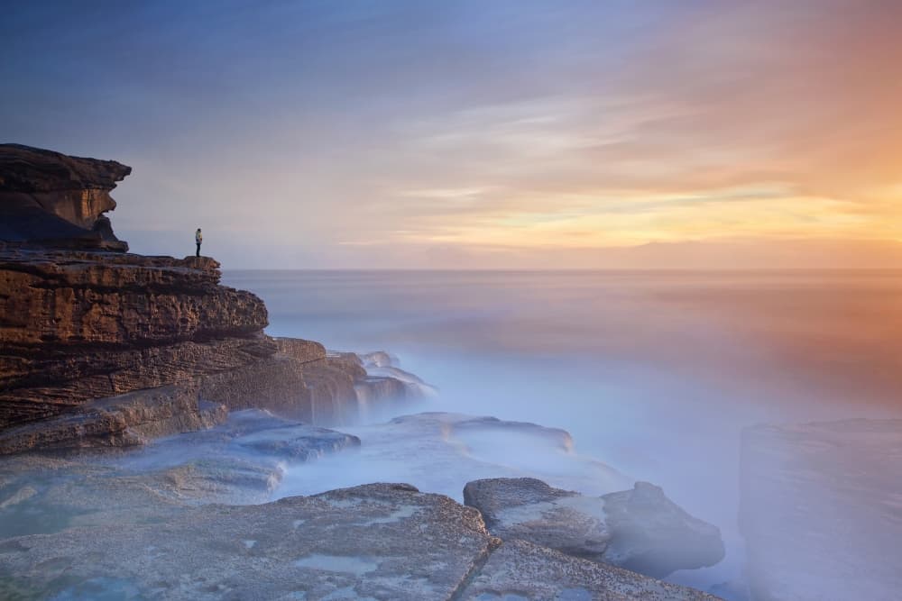 Solitary Figure Coastal Sunset by Yan Zhang — canvas wall art