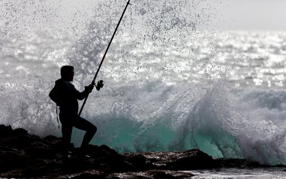 Fisherman Crashing Waves by Jorge Feteira — canvas wall art