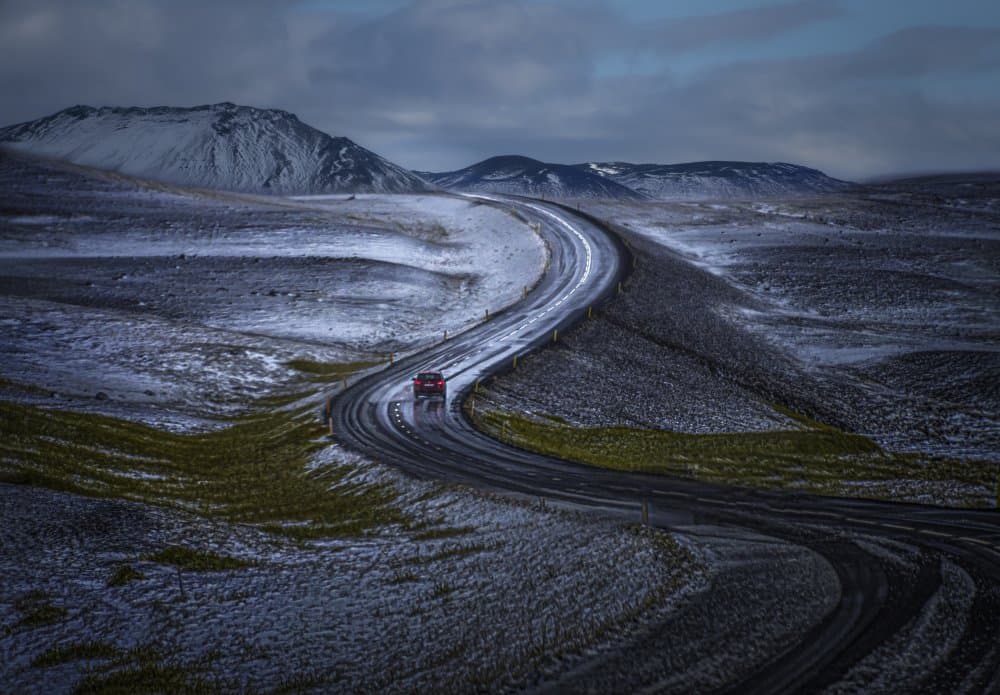 Red Car Winding Winter Road by John-Mei Zhong — canvas wall art