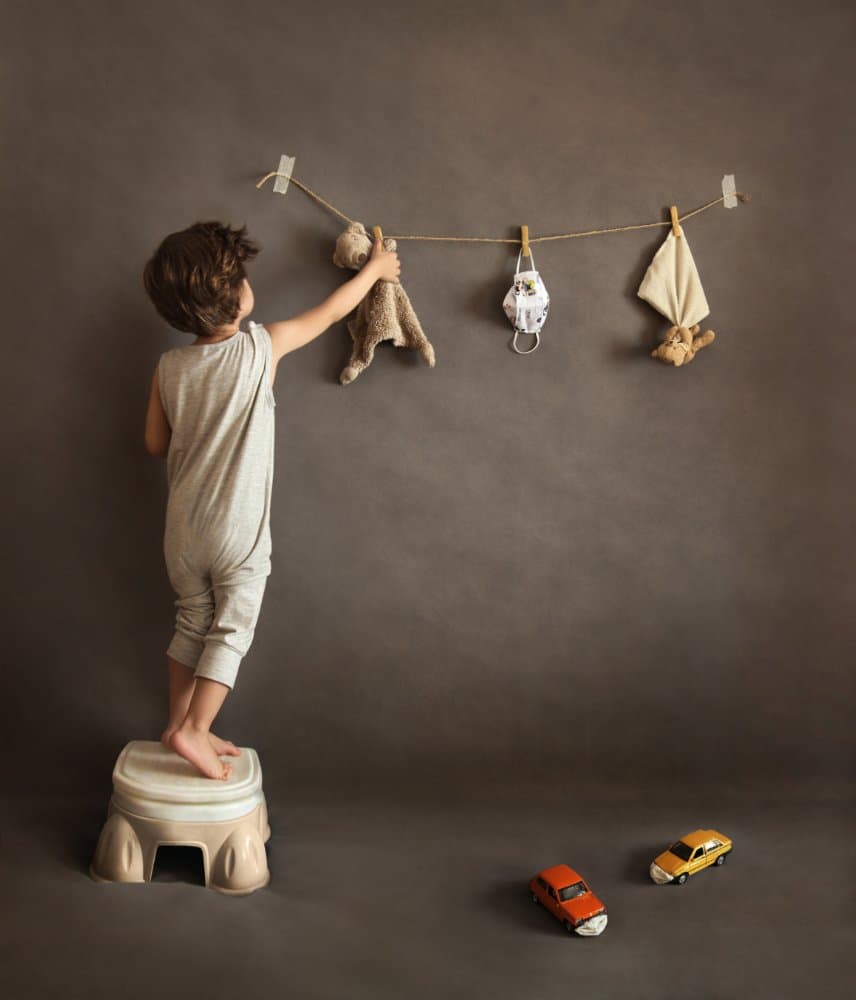 Boy Hanging Toys by Maryam sadat Ahmadi — canvas wall art